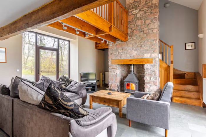 Lounge with log burner and comfortable seating