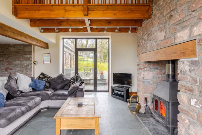 Lounge with log burner and comfortable seating